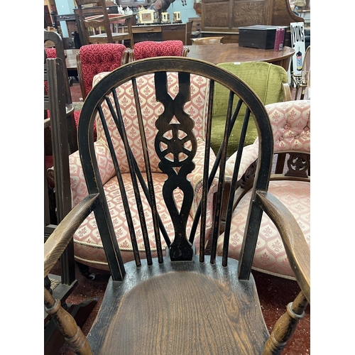 461 - Elm seated wheel back arm chair