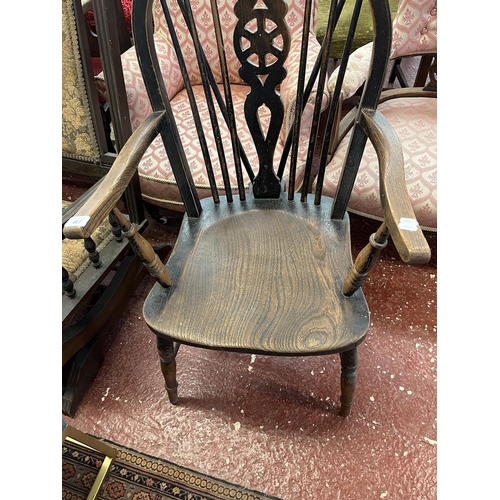 461 - Elm seated wheel back arm chair