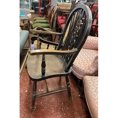 461 - Elm seated wheel back arm chair