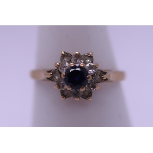 89 - 9ct gold Sapphire and CZ set ring