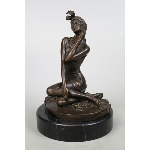 134 - 20thC bronze of a woman holding a phone marked 'noll' on marble stand - Approx H: 21cm