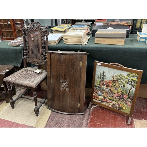 211 - Carved bergère chair together with corner cupboard and fire screen