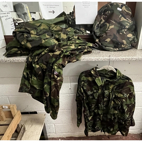 283 - Collection of waterproof and breathable camouflage jackets and 2x trousers together with rucksack