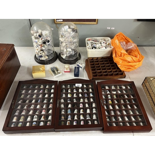 294 - Large collection of thimbles and display cases