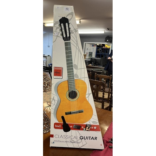 352 - Classical boxed guitar as new with teaching aids