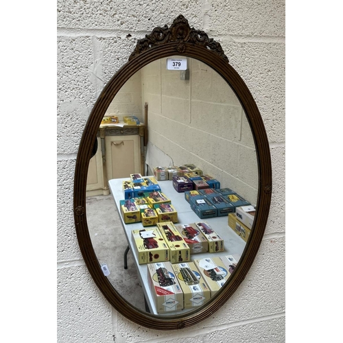 379 - Oval antique mirror