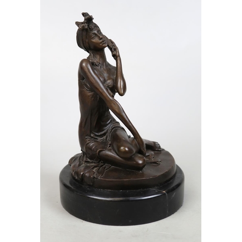 134 - 20thC bronze of a woman holding a phone marked 'noll' on marble stand - Approx H: 21cm