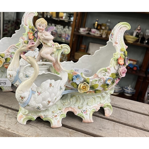 215 - Pair of antique table garnitures featuring swans and putti