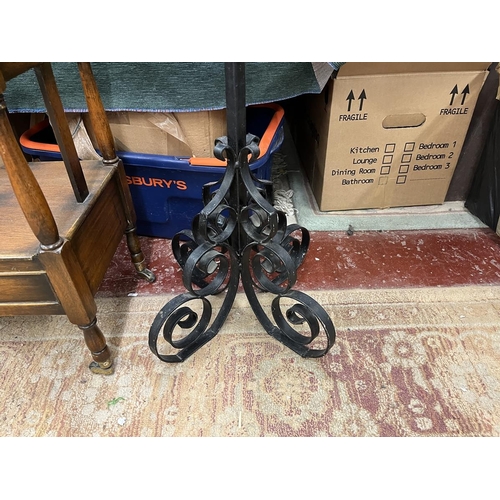 216 - Canterbury and large wrought iron candle stick