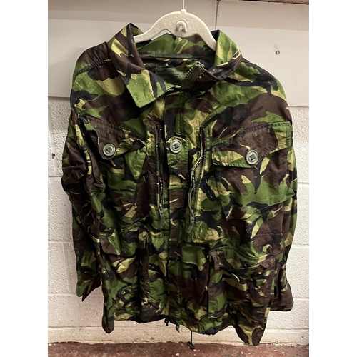 283 - Collection of waterproof and breathable camouflage jackets and 2x trousers together with rucksack