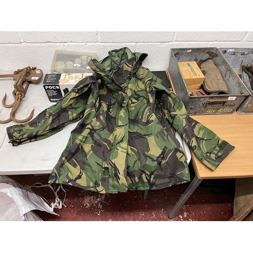 283 - Collection of waterproof and breathable camouflage jackets and 2x trousers together with rucksack