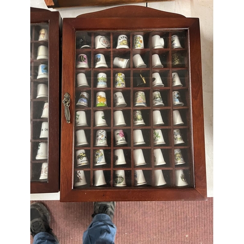 294 - Large collection of thimbles and display cases