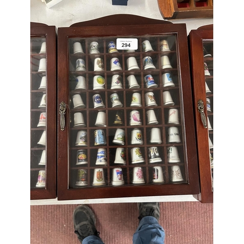 294 - Large collection of thimbles and display cases