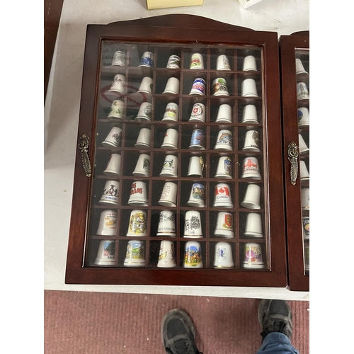 294 - Large collection of thimbles and display cases