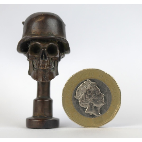 330 - Small bronze skull wearing helmet marked WW1 to base - Approx H: 4.5cm