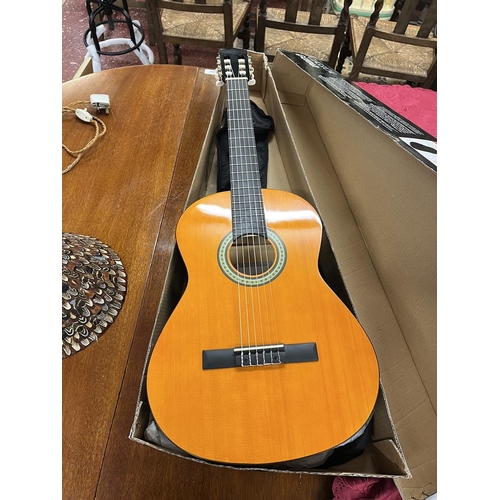 352 - Classical boxed guitar as new with teaching aids