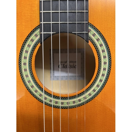 352 - Classical boxed guitar as new with teaching aids