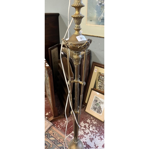 371 - Ornate brass standard lamp together with a wooden standard lamp