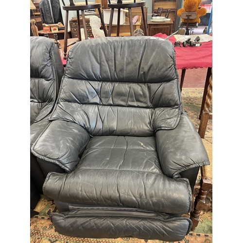 429 - Pair of leather swivel reclining armchairs