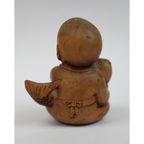 97 - Wooden Netsuke of boy holding fish - signed to base