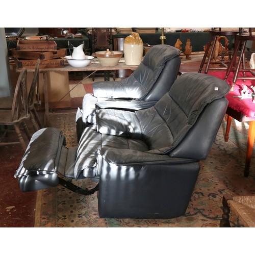 429 - Pair of leather swivel reclining armchairs