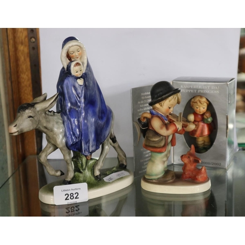 282 - Three figurines from the Hummel series by Geogal of Germany to include Madonna & Child seated on... 