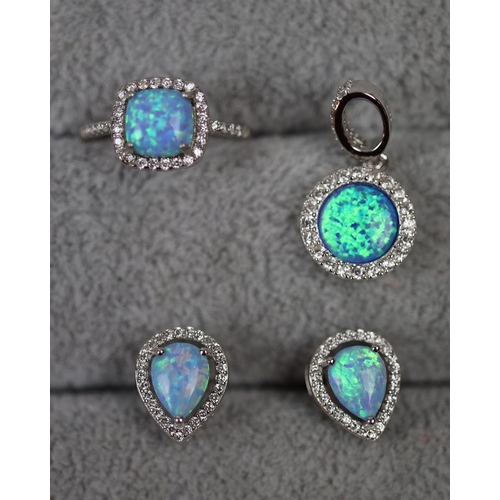 32 - Silver and opal ring together with silver and opal pendant and earrings