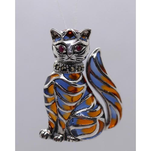 33 - Silver enamel ruby eyed cat brooch/pendant