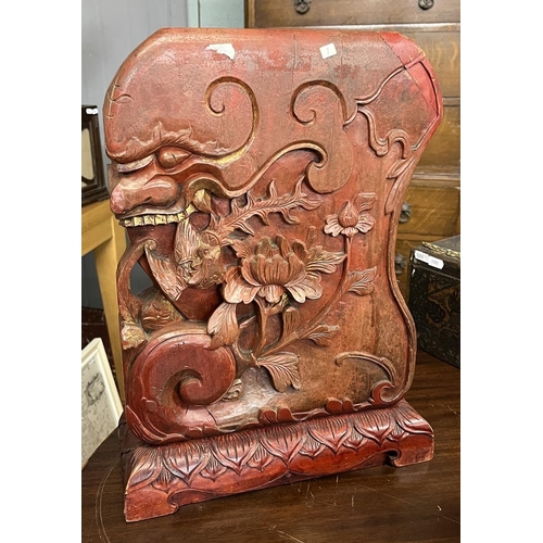 434 - Chinese red lacquered carved wooden piece showing a grotesque mask, bird and flowers - Approx H: 43c... 