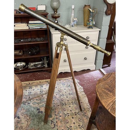 471 - 1900's style brass telescope on extending wooden tripod stand.