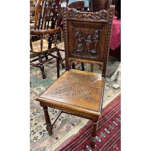 543 - Oak chair with fine carved back panel