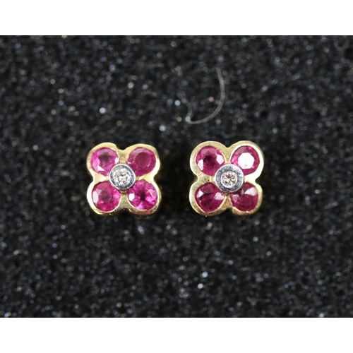 56 - 9ct ruby and diamond flower style stud earrings