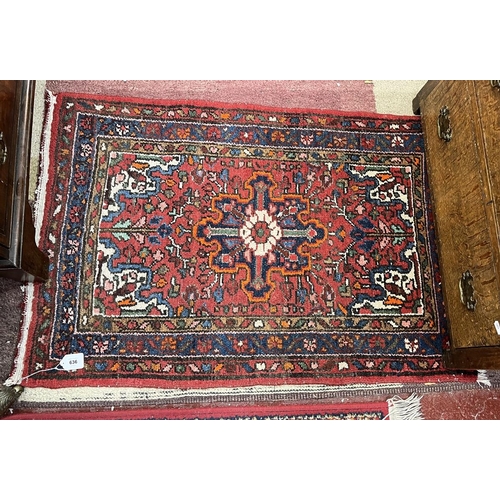 636 - Red patterned rug - Approx size 103cm x 67cm