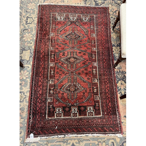 647 - Red patterned rug - Approx size 170cm x 97cm