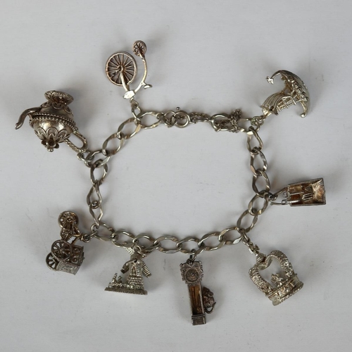 67 - Silver charm bracelet with 6 charms - Approx W 36.7g