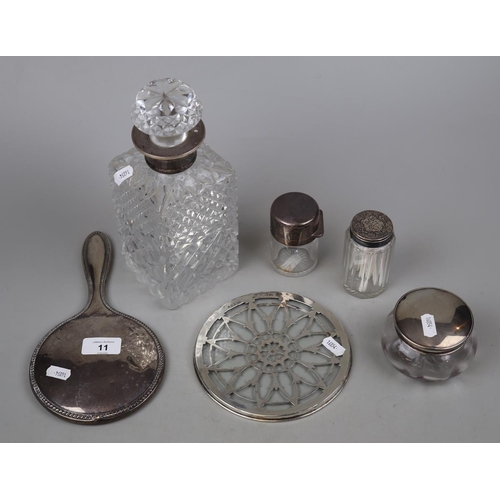 11 - Collection of hallmarked silver to include mirror, decanter and silver topped items