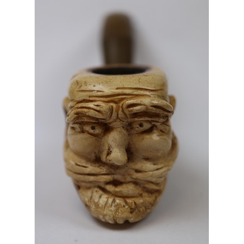 157 - Vintage 1960's hand carved Tanzanian block meerschaum pipe, together with a second carved meerschaum... 