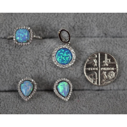 32 - Silver and opal ring together with silver and opal pendant and earrings