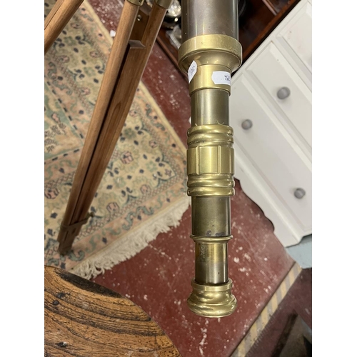 471 - 1900's style brass telescope on extending wooden tripod stand.