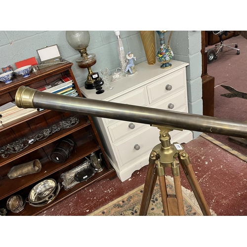 471 - 1900's style brass telescope on extending wooden tripod stand.