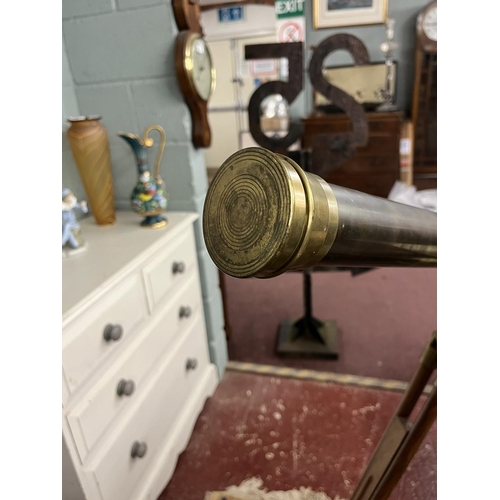 471 - 1900's style brass telescope on extending wooden tripod stand.