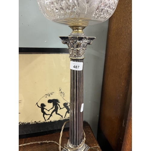 487 - Lamp - Raised on silver plate column Approx H: 87cm