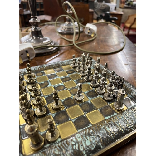 504 - Miniature bronze and zinc chess set