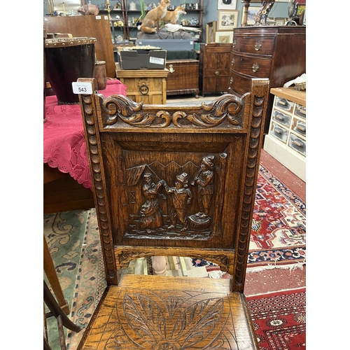 543 - Oak chair with fine carved back panel