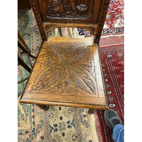 543 - Oak chair with fine carved back panel