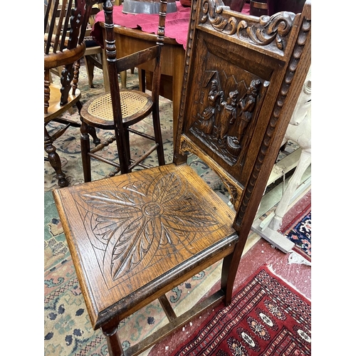 543 - Oak chair with fine carved back panel