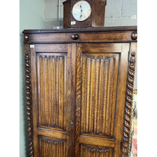 602 - Oak wardrobe with scroll work front - Approx W: 94cm D: 42cm H: 182cm