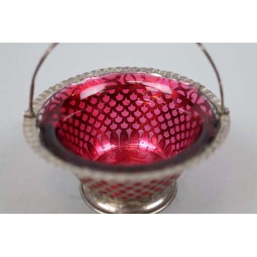 9 - Hallmarked silver pierced and ruby glass lined bonbon dish - Approx weight of silver 136g