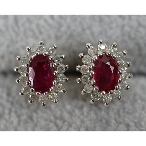 64 - Pair of 9ct gold diamond and ruby set earrings