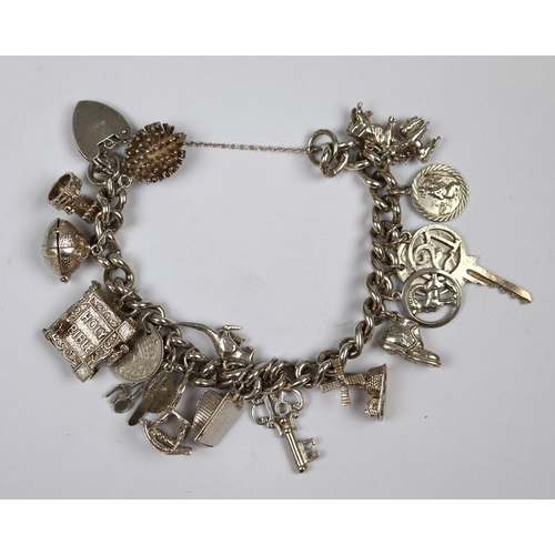 68 - Hallmarked silver charm bracelet with hallmarked silver charms